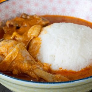 peanut butter soup (organic chicken) + swallow / rice – a rich and comforting west african delicacy crafted with a velvety peanut butter base, slow simmered in a flavorful blend of tomatoes, onions, garlic, and aromatic spices. tender organic chicken pieces are gently cooked in the savory soup, soaking up its nutty, slightly spicy flavor. served hot with your choice of soft swallow or perfectly steamed rice, this dish is hearty, wholesome, and deeply satisfying. a perfect balance of creamy texture, rich taste, and nourishing goodness that brings warmth and tradition to every bite.